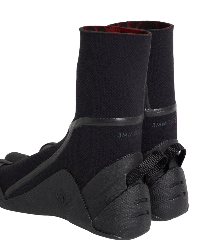 The Roxy 3.0 Elite Split Toe Boot is a pair of black neoprene surf booties with textured soles, high ankle cuffs, reinforced heels, “3MM ELITE” along the side, and visible red interior lining.