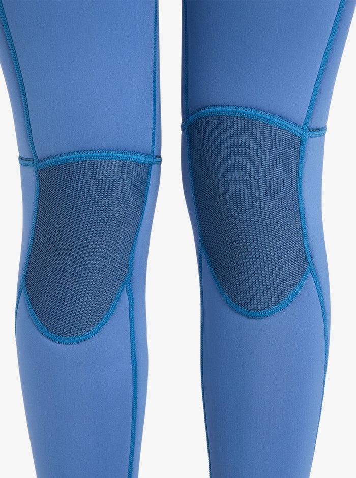 Close-up of the Roxy 4/3mm Prologue Girls’ Back Zip Wetsuit in blue, highlighting reinforced, textured knee patches for enhanced durability and support.