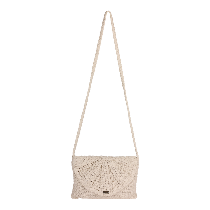 The Roxy Chips And Guac Medium Crossbody Bag in Egret features a beige crochet design with a long braided strap and a flap closure adorned with a sunburst pattern, making it the perfect hands-free everyday essential, shown against a plain white background.