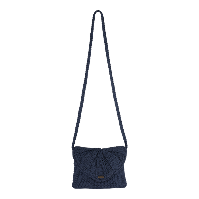 The Roxy Chips And Guac Medium Crossbody Bag, featuring a navy blue crocheted design with a long strap and a flap closure for hands-free convenience, is showcased against a plain white background.