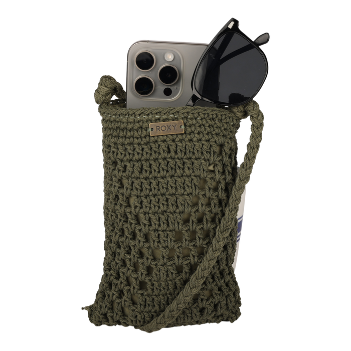 The Chips And Guac Phone Bag by Roxy is a green crocheted crossbody pouch with a strap, designed to hold a smartphone and a pair of black sunglasses, and features a small metal Roxy label on the stylish bag.