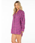 A woman with long blonde hair wears the Roxy Driftwood Top in Naval Academy Sunburst Plaid, standing against a plain white background and smiling softly.
