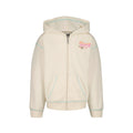 The Roxy Girls' Coastal Cruiser Zip Hoodie is an oversized, cream-colored hoodie made from soft cotton-poly fleece with a hood, front pockets, light blue stitching, and a pink heart logo on the left chest.
