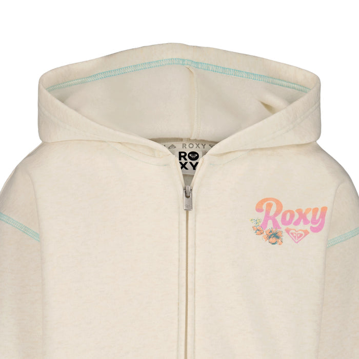 The Roxy Girls' Coastal Cruiser Zip Hoodie features soft cotton-poly fleece in cream, a pink and orange logo with floral detail on the left chest, and stylish light blue seam stitching.