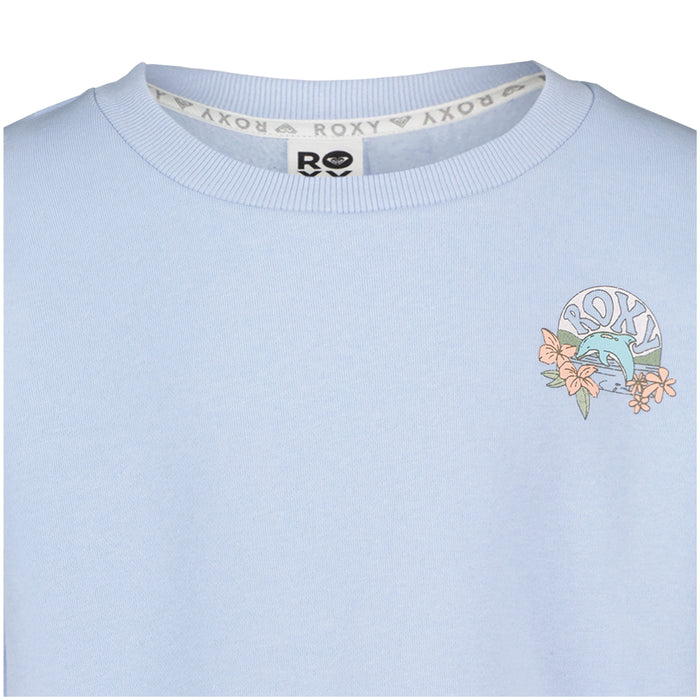 The Girls’ Ocean Explorer Crew by Roxy is a light blue oversized fleece sweatshirt featuring the ROXY logo, a wave, and orange flowers printed on the upper left chest. This girls’ crew neck pullover also has a repeating ROXY pattern along the inside neckline tape for added style.