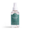 A clear 4 oz (125 ml) Roxy Hibiscus Wave Body Mist bottle with a white pump and teal label features the Orange Blossom + Sea Salt scent, blending citrus perfume notes.
