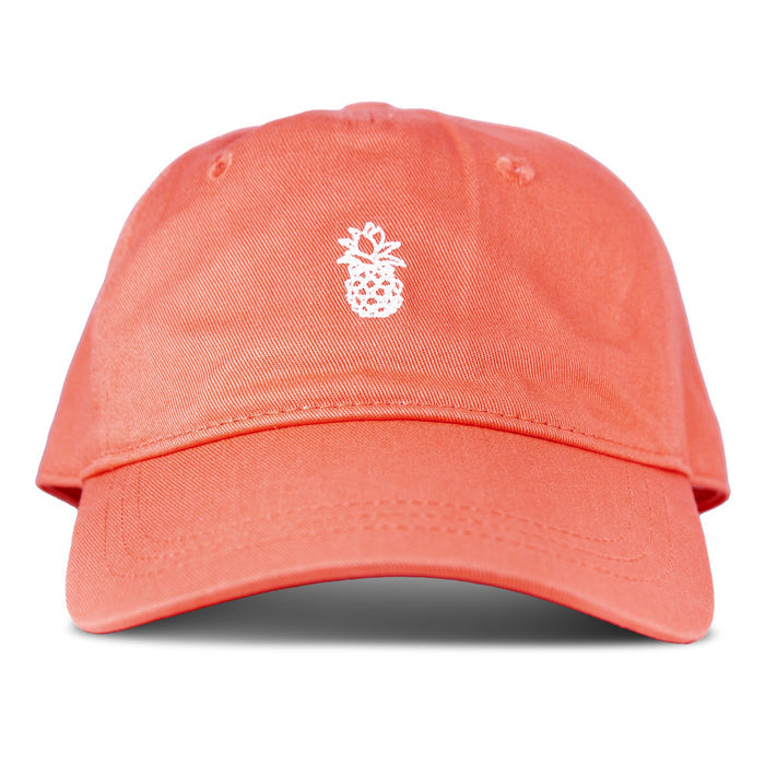The Roxy Next Level Cap is a women’s baseball hat in papaya, crafted from soft cotton twill, featuring a small white embroidered pineapple on the front and a classic curved visor, shown against a white background.