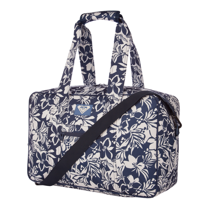 The Roxy Off Shore Duffel Bag, featuring a blue and white floral pattern, includes two handles and a detachable shoulder strap. It is displayed against a plain white background.