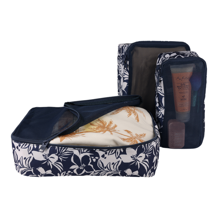 Here’s a rewritten sentence using your product data: The Roxy Packing Cube Set, featuring two navy blue and white floral cubes crafted from lightweight ripstop fabric—one displayed open with folded clothes inside, the other upright with mesh revealing toiletries or small items—keeps your belongings organized and secure on every journey.