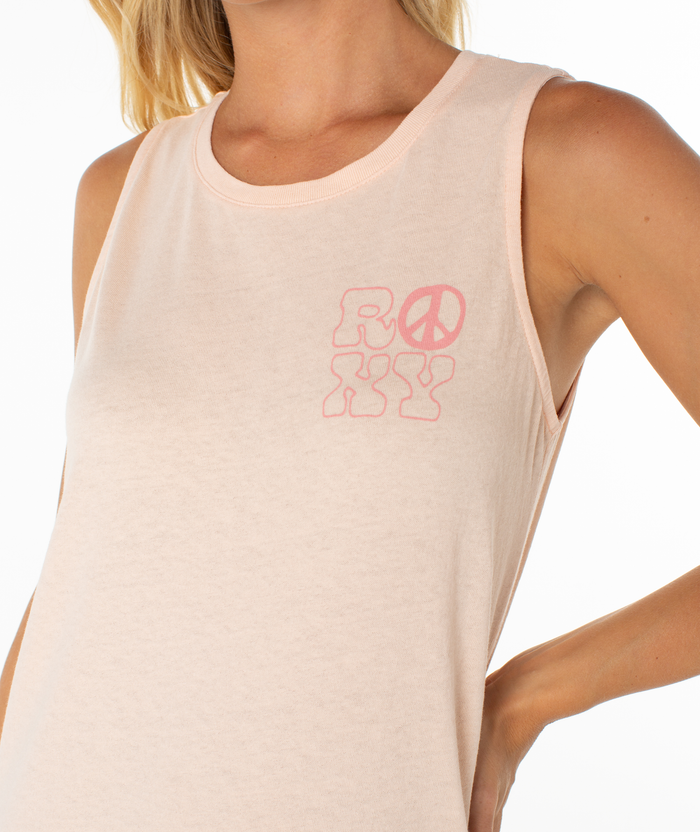 A person confidently models the Roxy Peace Waves Wildflower Midi Dress, capturing relaxed beachside vibes. Their head is partially out of frame, and one hand rests on their hip like a breezy dress model.
