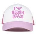 A lilac sachet Sandy Top Trucker cap by ROXY featuring the words “I love Beach Days” printed in pink on the front, a stylized heart design above the text, and an adjustable snapback for comfort and sun protection.