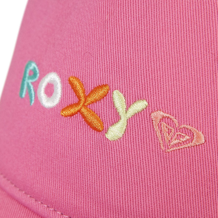 Close-up of pink fabric on the Roxy TW Next Level Baseball Cap, featuring the word ROXY embroidered in colorful thread and a stitched heart outline beside the text—making this cap a versatile accessory and everyday essential.
