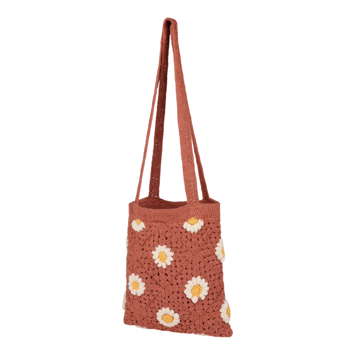 The Roxy Wandering Beach Crochet Tote Bag in Canyon Rose features white and yellow daisy patterns and two long handles, making it a perfect casual shoulder bag for everyday use, shown against a plain white background.