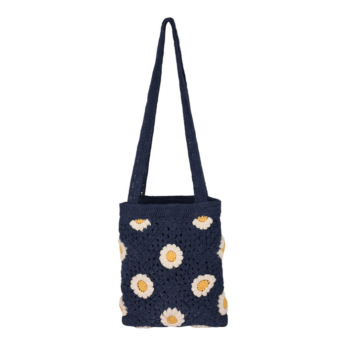 The Wandering Beach Crochet Tote Bag by Roxy in Vintage Indigo features white and yellow daisy flower patterns, displayed on a plain white background. This lightweight tote bag is perfect for adding a charming, handmade touch to your everyday look.