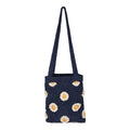 The Wandering Beach Crochet Tote Bag by Roxy in Vintage Indigo features white and yellow daisy flower patterns, displayed on a plain white background. This lightweight tote bag is perfect for adding a charming, handmade touch to your everyday look.